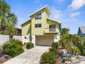 Beautiful two story home with a lush landscaped yard, balcony, and attached two car garage at 6321 Garland Ct, New Port Richey, FL 34652