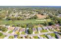 Beautiful aerial view of a well-kept community, golf course, and the home's location at 7499 Blue Skies Dr, Spring Hill, FL 34606