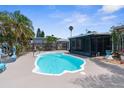 Enjoy this private backyard pool and screened-in lanai, perfect for outdoor relaxation and entertainment at 13411 Lisa Dr, Hudson, FL 34667