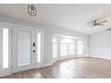 Bright living room with vaulted ceilings, wood floors, and natural light at 305 Yellow Elder, Punta Gorda, FL 33955