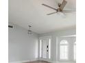 Spacious room with high ceilings, light-colored walls, and modern ceiling fan at 305 Yellow Elder, Punta Gorda, FL 33955