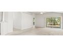 Bright, spacious living area with sliding glass doors providing natural light and access to the outdoors at 3885 Crossline Dr, Spring Hill, FL 34609