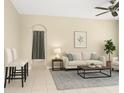 Bright living room featuring neutral tones, tile floors, and modern furnishings at 4330 Crosswhite Ct, Spring Hill, FL 34609