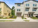 A well maintained two story townhome with an attached garage and lovely landscaping at 4740 Tuscan Loon Dr, Tampa, FL 33619