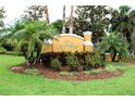 Attractive community sign that reads 'Villas at Gulf Harbors' surrounded by lush, manicured landscaping at 4837 Rainbow Race, New Port Richey, FL 34652