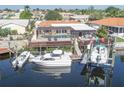 Screened-in lanai, wooden deck, boat dock, and lift provide the perfect outdoor space at 5008 Forecastle Dr, New Port Richey, FL 34652