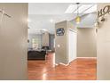 Open-concept living area with hardwood floors, a cozy fireplace, and ample natural light at 5422 Foley Sq, New Port Richey, FL 34652