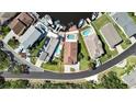 Aerial view of a residential home showcasing the property layout and neighborhood at 6340 Spoonbill Dr, New Port Richey, FL 34652