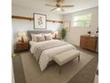 Cozy bedroom with plush carpeting, a comfortable bed, and bright natural light at 6450 Limerick Ave, New Port Richey, FL 34653