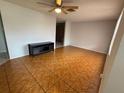 Spacious living room featuring stylish tile flooring and ample natural light at 6450 Limerick Ave, New Port Richey, FL 34653