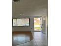 Inviting living room featuring wood and tiled floors and ample natural light at 7331 Sandalwood Dr, Port Richey, FL 34668