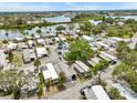 Aerial view of the community by the water, showcasing the many homes at 800 Chesapeake Dr # 42, Tarpon Springs, FL 34689