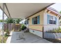 Charming single-story home with carport and landscaped front yard provides a welcoming curb appeal at 803 Frances Dr, Tarpon Springs, FL 34689