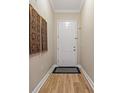 Neat entryway featuring hardwood floors and tasteful decor, setting a welcoming tone at 11401 Quiet Forest Dr, Tampa, FL 33635