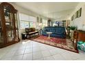 Inviting living room with elegant decor, large mirror, and ample natural light at 11631 Bayonet Ln, New Port Richey, FL 34654