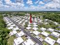 Expansive aerial of a residential community with mature trees and well-maintained landscaping at 11821 Boynton Ln, New Port Richey, FL 34654