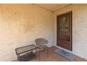 Cozy front porch featuring a seating area and a charming welcome sign at 12250 Lacey Dr, New Port Richey, FL 34654