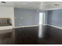 Spacious living room with hardwood floors and a fireplace, perfect for entertaining at 2083 Envoy Ct, Clearwater, FL 33764