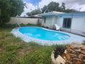 Backyard swimming pool with a slide at 2083 Envoy Ct, Clearwater, FL 33764