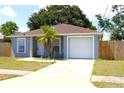 Charming single-story home with attached garage, nicely kept lawn, and inviting curb appeal at 3315 W Saint John St, Tampa, FL 33607