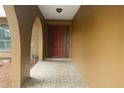 Inviting entryway with tiled floor leads to a solid wood front door offering privacy and curb appeal at 4190 Lema Dr, Spring Hill, FL 34609