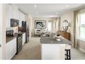 Modern kitchen featuring stainless steel appliances, granite countertops, and an open dining area at 4511 Spire Run, Lakewood Ranch, FL 34211