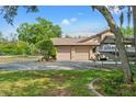 View of the garage with boat parking on the side at 5216 Hope Ln, Spring Hill, FL 34606