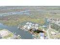 Aerial view of waterfront house with private dock on a green lot outlined in red at 5234 Foxhall Ct, Weeki Wachee, FL 34607