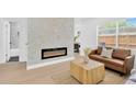 Bright living room featuring a decorative fireplace and modern furniture at 5753 2Nd N Ave, St Petersburg, FL 33710