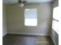 Bright bedroom with hardwood floors and a window providing natural light at 7419 E Comanche Ave, Tampa, FL 33610
