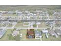 Aerial view of home featuring a private backyard pool in a waterfront community at 7520 Mako Dr, Hudson, FL 34667