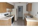 Functional kitchen with ample cabinets and appliances, offering a practical space for cooking and storage at 7600 St. Andrews Blvd # 7600, Weeki Wachee, FL 34613