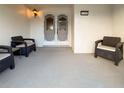 Cozy front porch with seating, perfect for relaxing near the decorative double doors at 11141 Sandtrap Dr # 11141, Port Richey, FL 34668