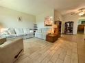 Inviting living room featuring tile floors and comfortable seating, perfect for relaxation at 11911 Bayonet Ln, New Port Richey, FL 34654