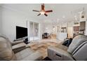 Spacious living room featuring an open floor plan, neutral tones, and ample seating at 18520 Hidden Pines Way, Hudson, FL 34667