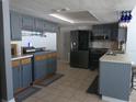 Updated kitchen featuring modern appliances, stylish cabinetry, and tile flooring at 3207 Jarvis St, Holiday, FL 34690