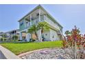 Charming two-story waterfront home with lush landscaping, a spacious balcony, and canal access at 3546 Flamingo Blvd, Hernando Beach, FL 34607