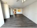 Spacious living room with ceiling fan and hardwood floors at 4823 Ebbtide Ln # 105, Port Richey, FL 34668