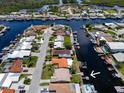 Fantastic aerial view showcasing waterfront homes with private docks and boat access at 4937 Dory Dr, New Port Richey, FL 34652