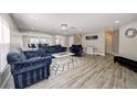 Spacious living room featuring modern decor, wood floors, and an open floor plan at 6222 Cherry Blossom Trl, Gibsonton, FL 33534