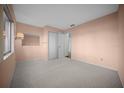 Bedroom featuring neutral carpet, and a spacious closet at 7682 St Andrews Blvd, Weeki Wachee, FL 34613
