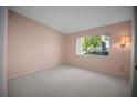 Cozy bedroom with natural light, neutral carpet and wall color at 7682 St Andrews Blvd, Weeki Wachee, FL 34613