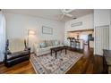 Cozy living room featuring hardwood floors and view into kitchen at 7807 Hardwick Dr # 123, New Port Richey, FL 34653