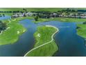 Picturesque aerial view of a golf course community with lakes and lush landscaping at 9933 Milano Dr, Trinity, FL 34655