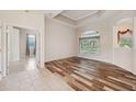 Spacious living room featuring hardwood floors and lots of natural light at 10296 Palmgren, Spring Hill, FL 34608