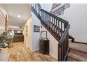 Welcoming foyer with wood-look tile flooring and staircase at 1108 Blackwater Dr, Wesley Chapel, FL 33543