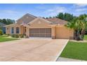 Charming single-story home featuring a well-maintained lawn and a spacious two-car garage at 13155 Cori Loop, Spring Hill, FL 34609