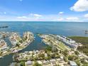 Scenic aerial view showcases a waterfront community with marina and residential homes at 14220 Hendry Ct, Hudson, FL 34667
