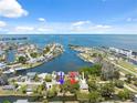 Beautiful aerial view of waterfront community with homes indicated by colored arrows at 14220 Hendry Ct, Hudson, FL 34667