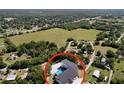 An aerial view showcases a private pool and the lush greenery surrounding the home at 6158 Sumter Dr, Brooksville, FL 34602